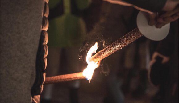 Contemplative torchlight walk
